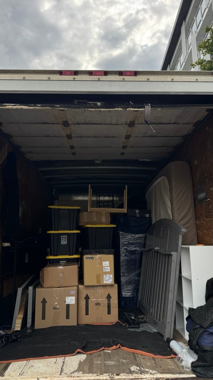 Moving truck packed with boxes and furniture