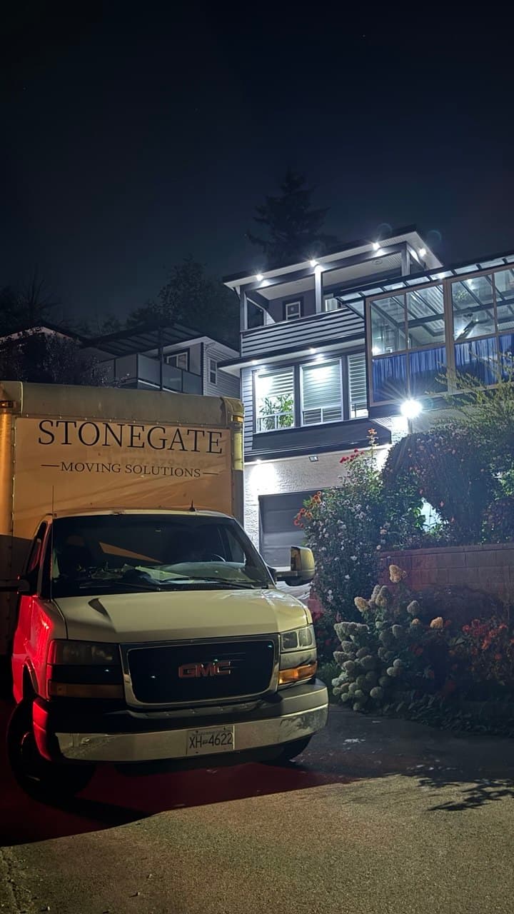 Stonegate Moving Solutions truck parked outside a Burnaby home
