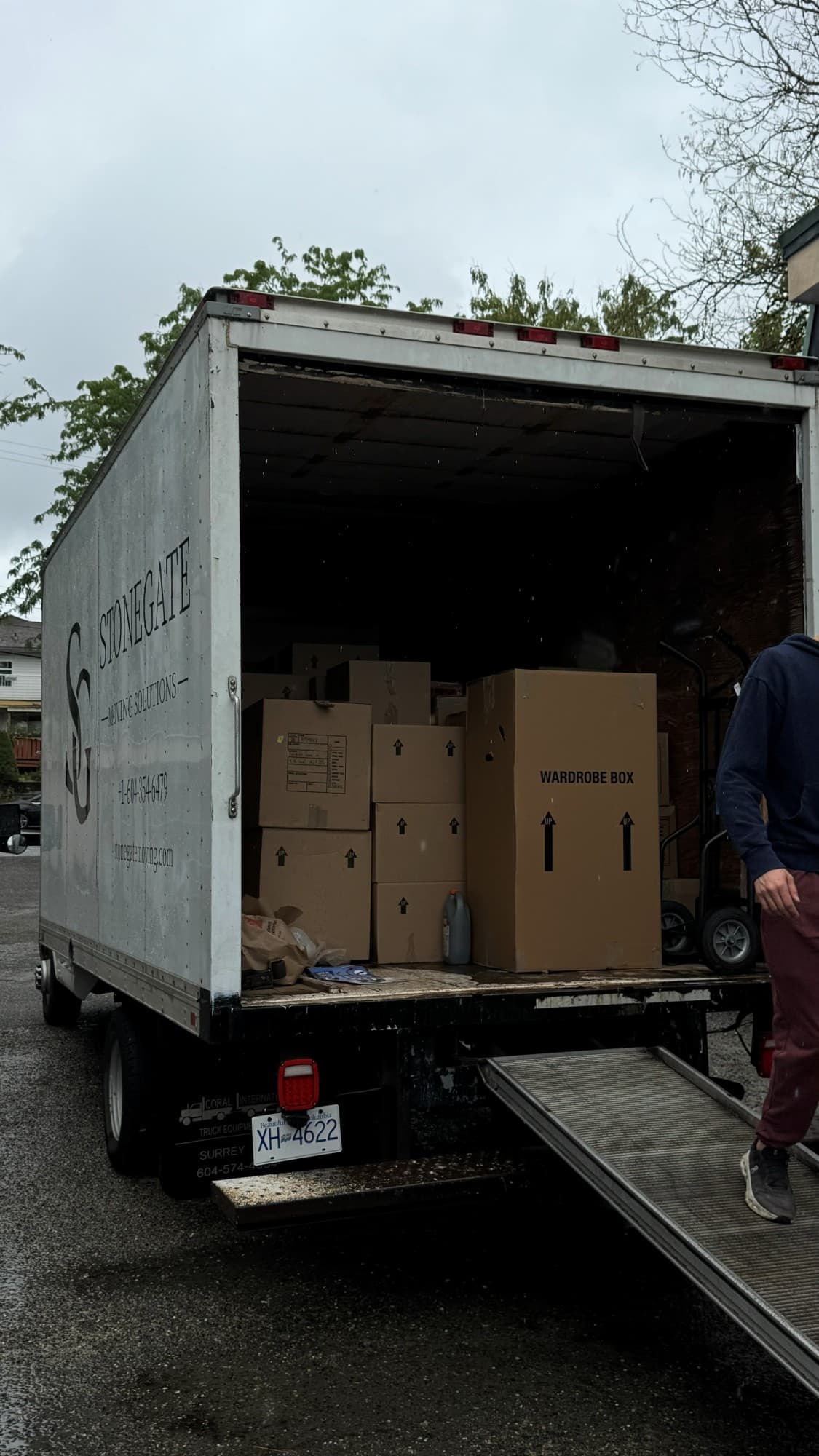 Stonegate Moving Solutions truck loaded with a wardrobe box and moving boxes during a Burnaby move