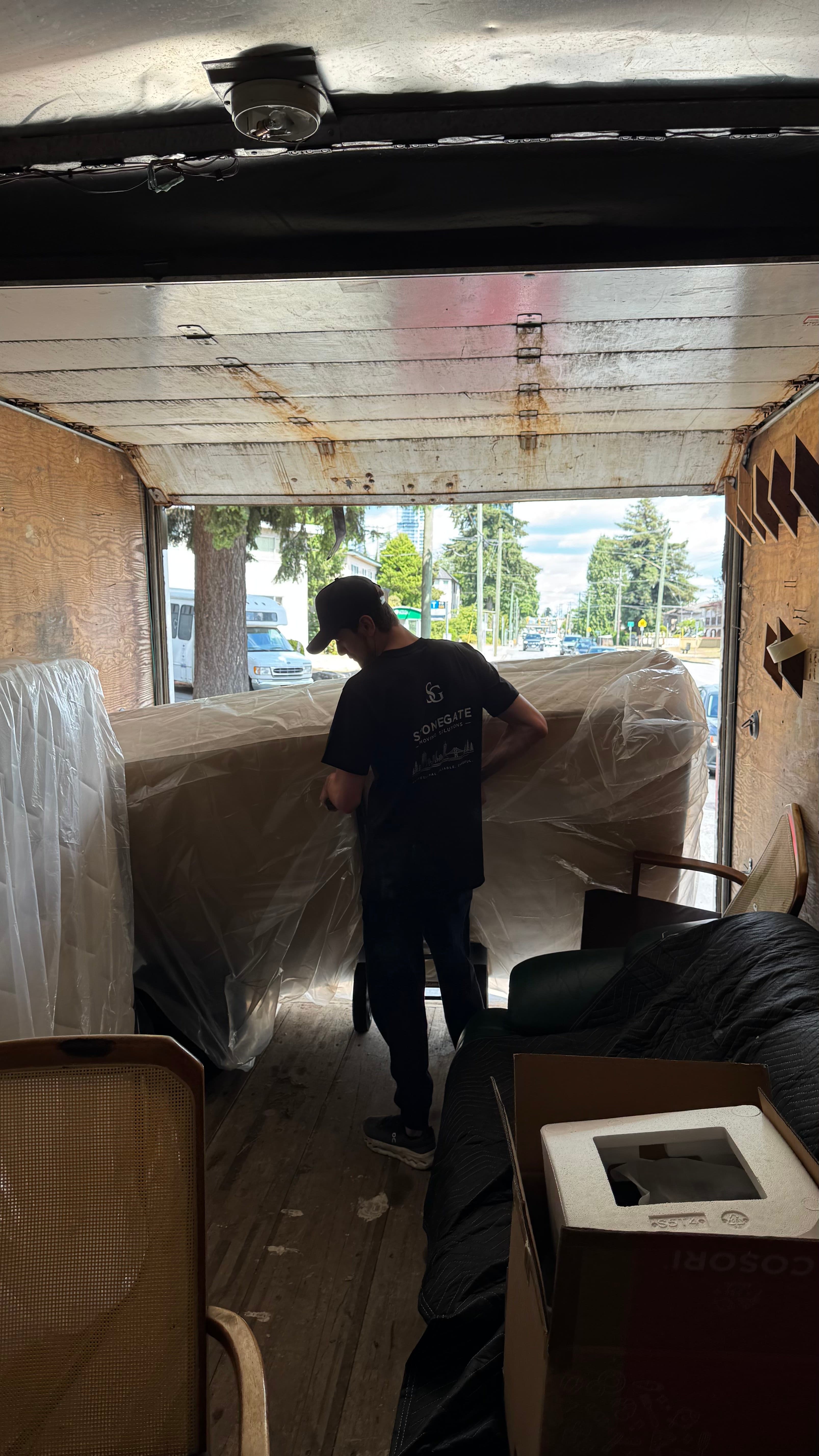 Stonegate crew wrapping and loading furniture for a house move