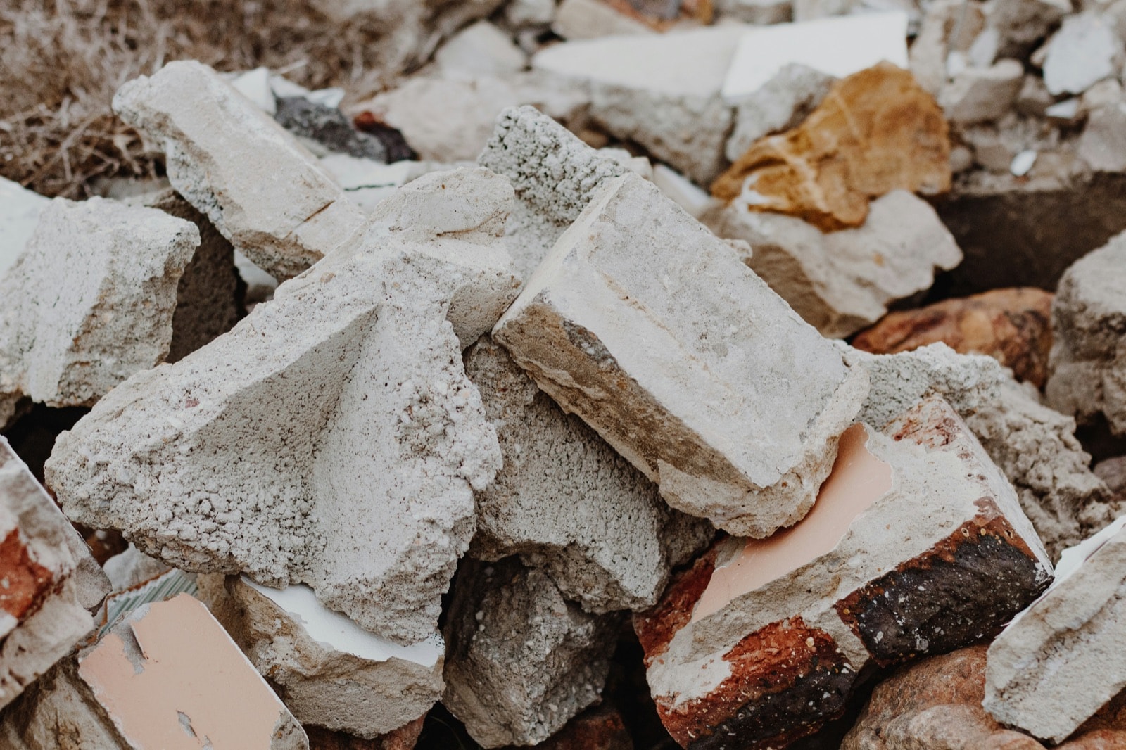 Pile of broken concrete, bricks and rubble ready for concrete removal
