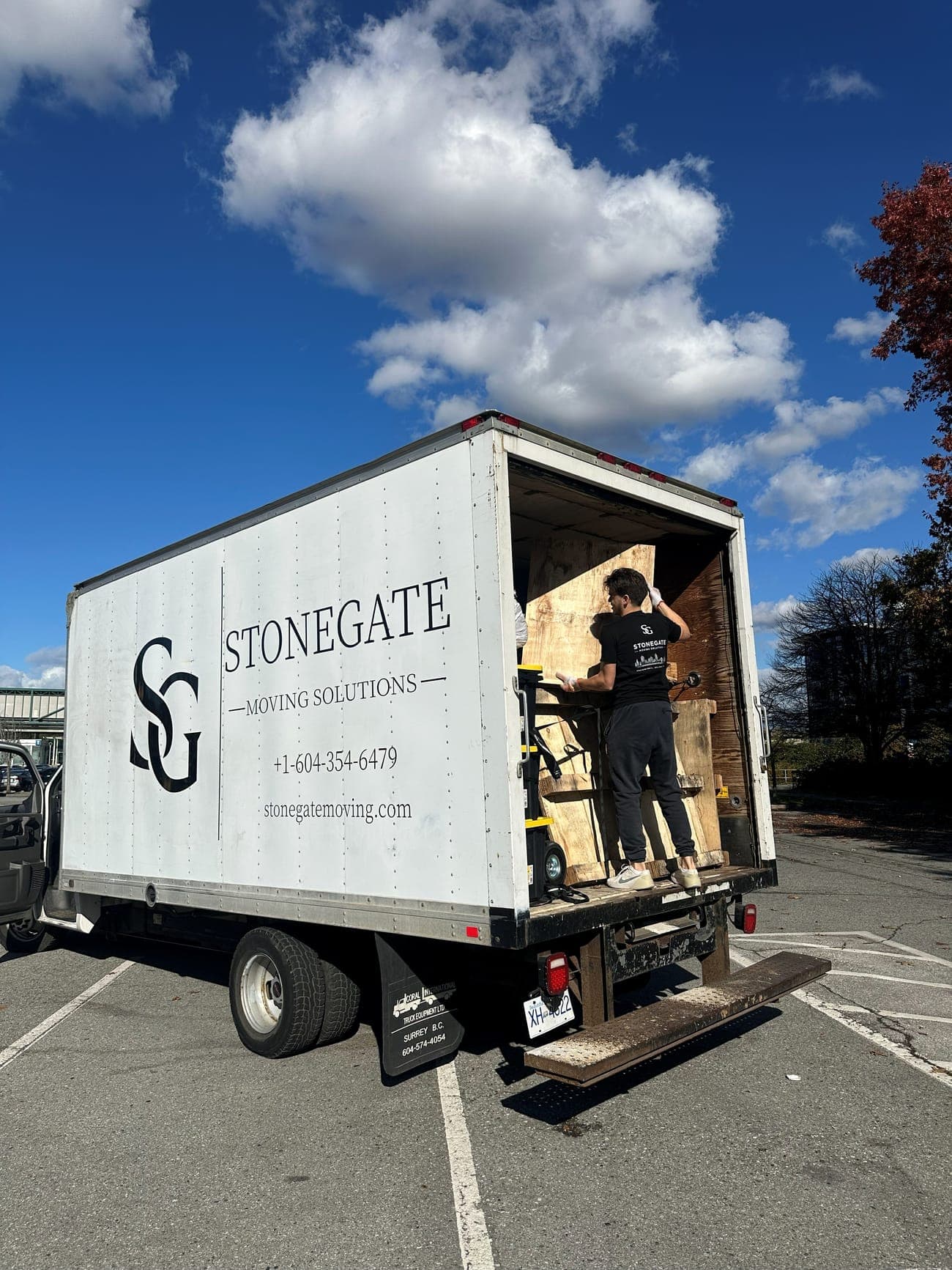 Stonegate mover loading the branded moving truck in Port Coquitlam