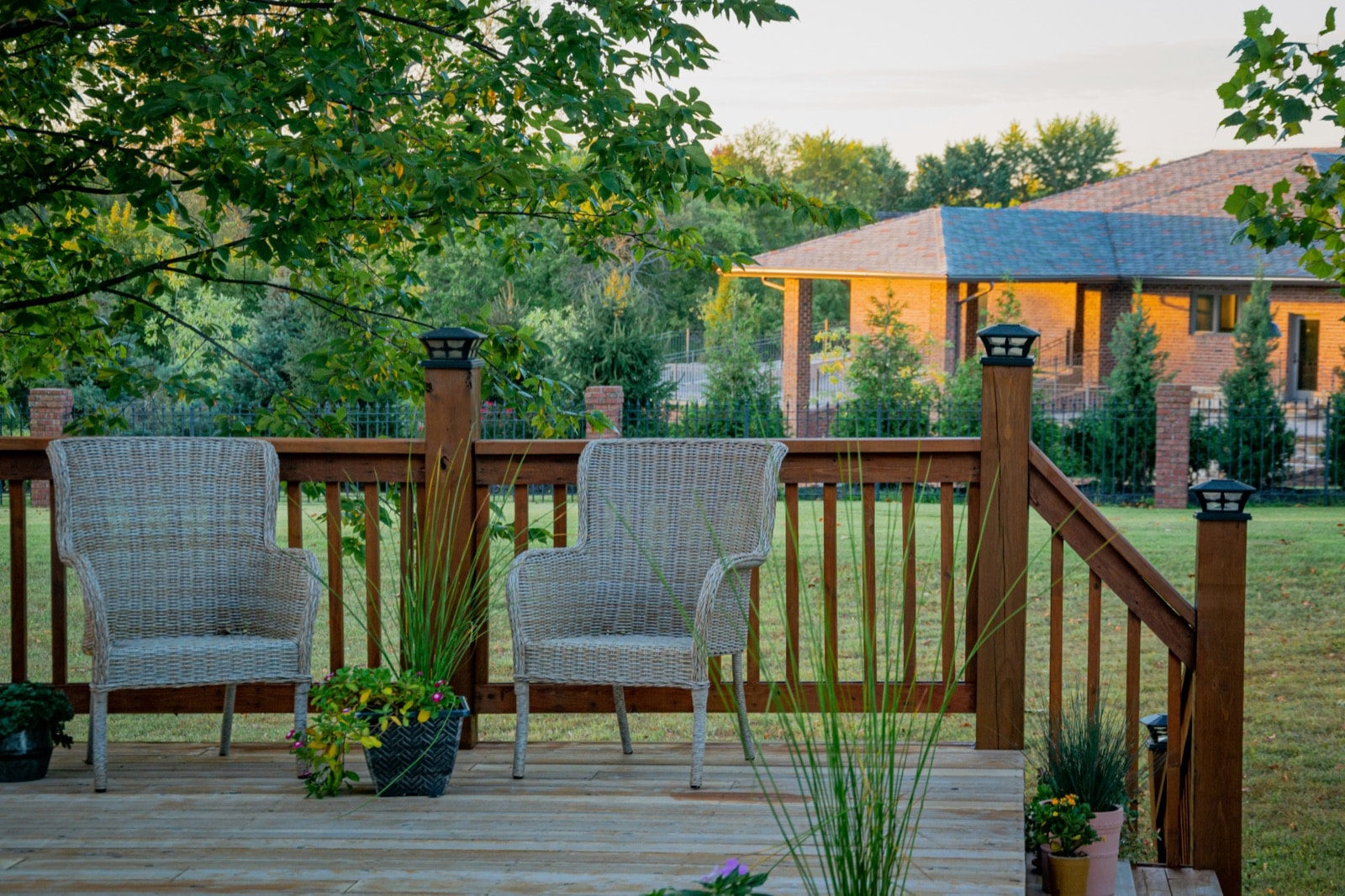 Wooden backyard deck with railings and stairs, the kind we tear out and haul away during deck removal