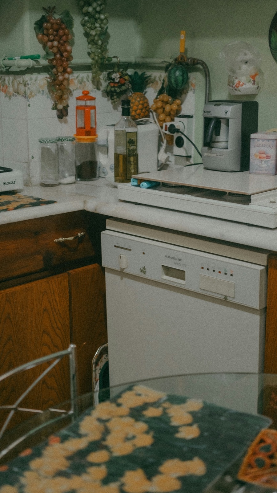 Old built-in dishwasher in a dated kitchen, ready for dishwasher removal