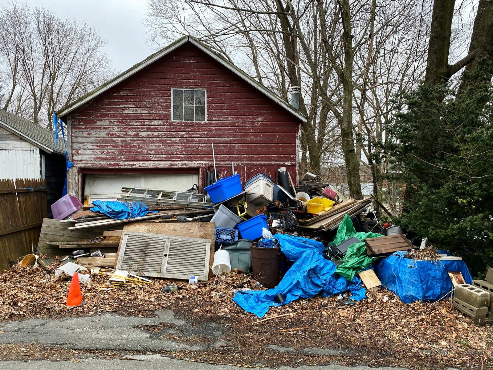 Household belongings piled outside a property before an estate cleanout