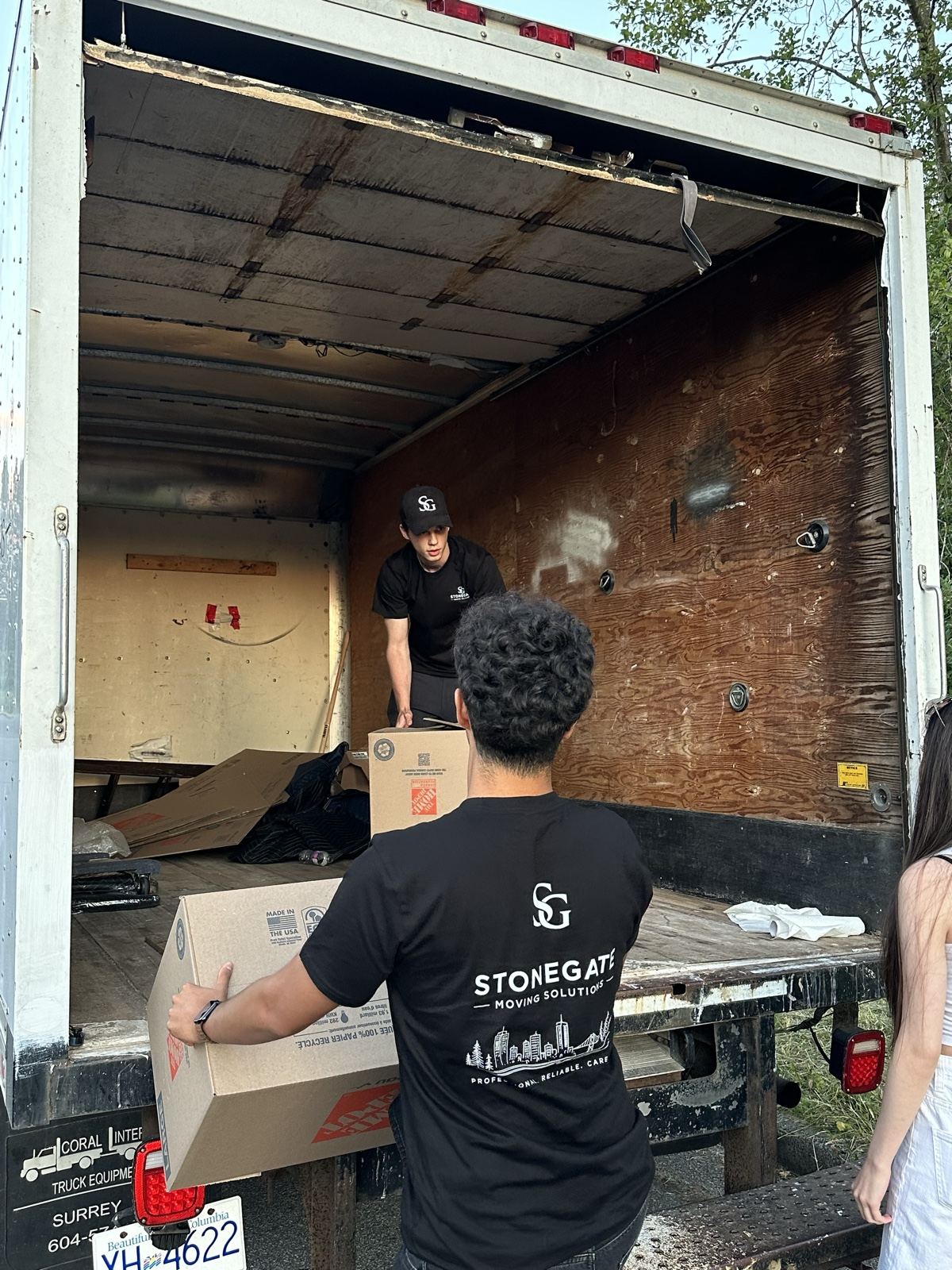 Stonegate crew loading boxes during an apartment move-out cleanout