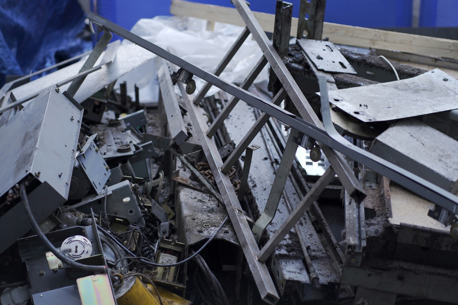 Pile of scrap metal - steel bars, brackets, panels and cable - ready for scrap metal removal