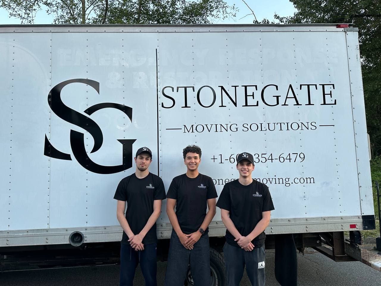 The Stonegate crew standing in front of the truck